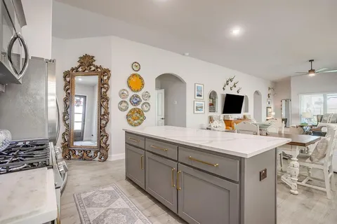 a view of living room with furniture and flat screen tv