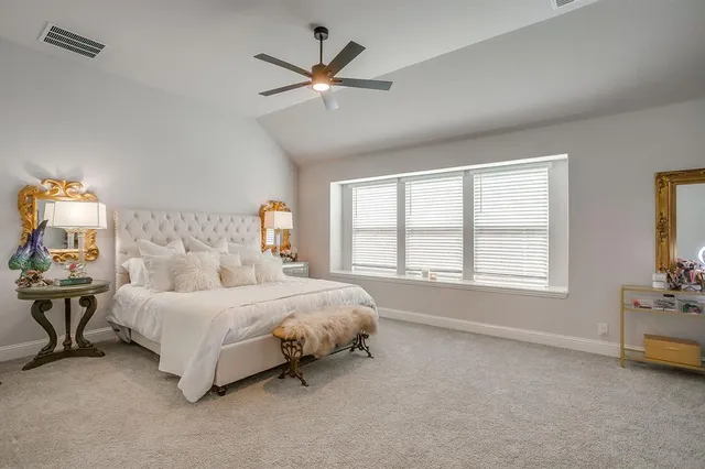 a bed room with a bed and a tv