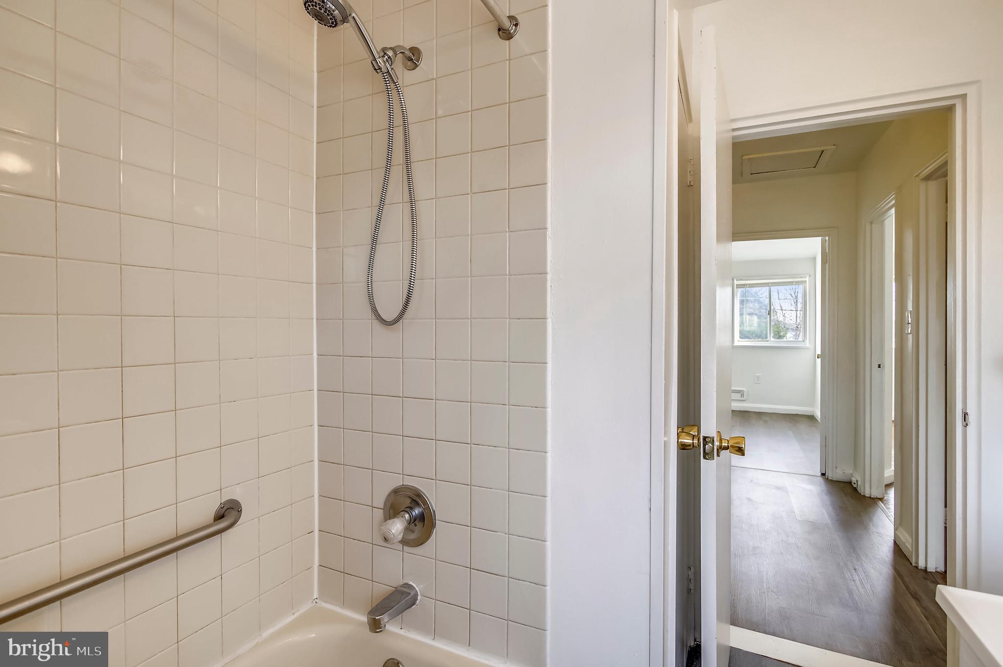 2019 Holborn Road Baltimore, MD 21222 - Photo 15 of 42 a bathroom with a glass shower door