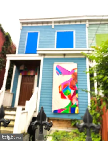 a view of small area with painting on the wall