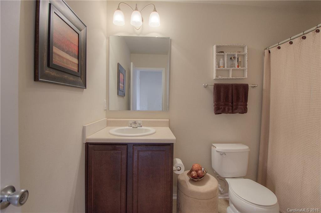 311 River Clay Road Fort Mill, SC 29708 - Photo 19 of 26 a bathroom with a toilet a sink and mirror