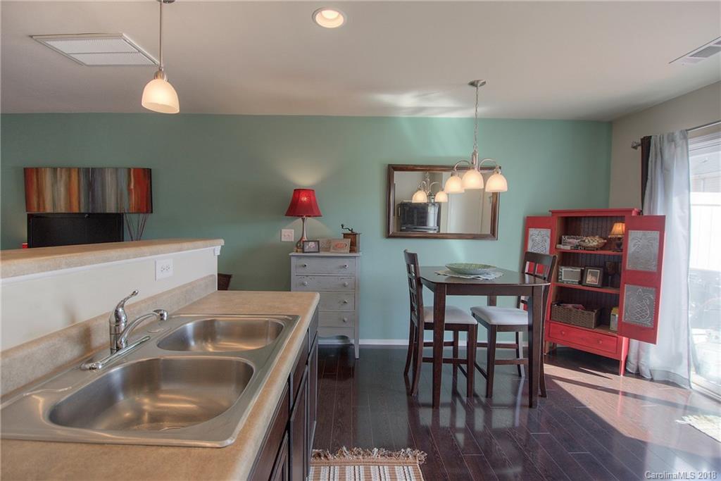 311 River Clay Road Fort Mill, SC 29708 - Photo 9 of 26 a kitchen with sink a table and chairs