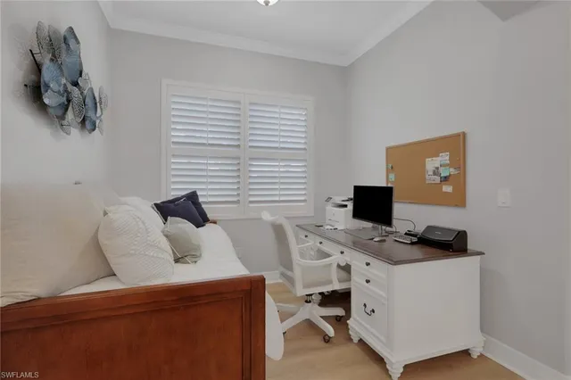 a bed room with a bed and a chandelier