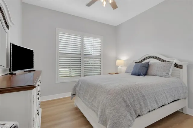 a bed room with a bed and a window