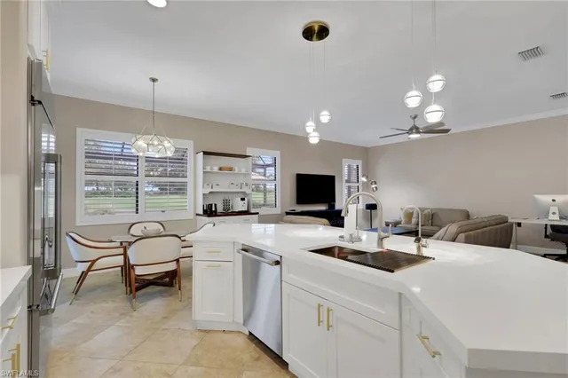 a view of a patio with a table chairs and a backyard