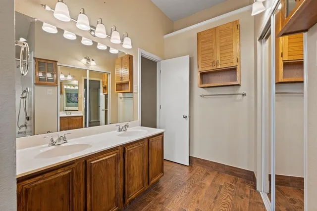 a bathroom with a sink double vanity and a mirror