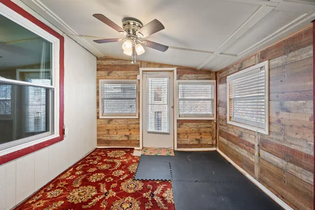 a view of an empty room and a window