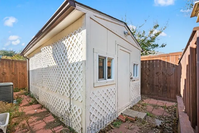 a view of a house with a small yard