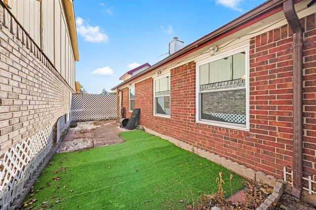 a backyard of a house with seating space