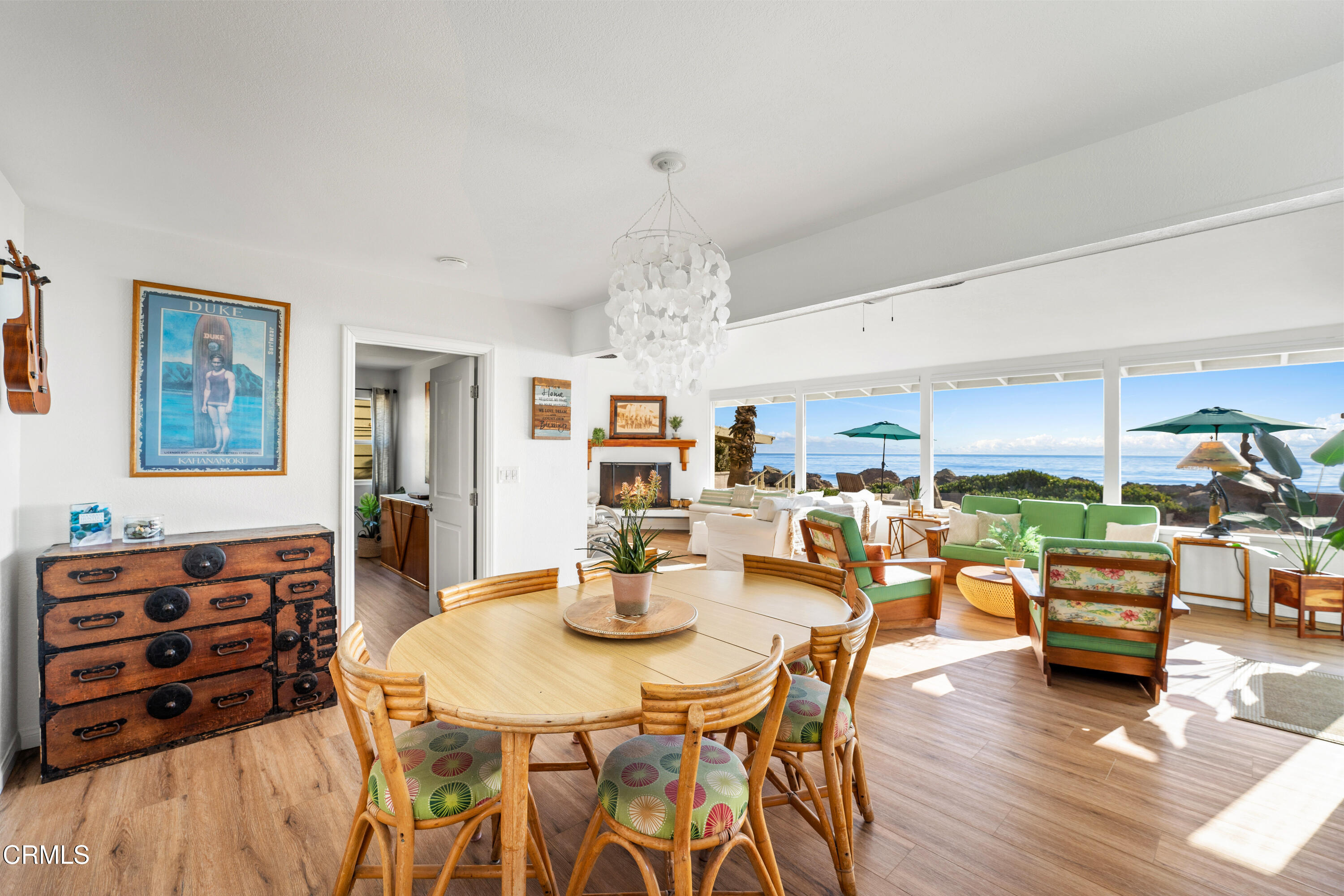 3048 Solimar Beach Drive Ventura, CA 93001 - Photo 13 of 35 a view of a dining room with furniture and chandelier