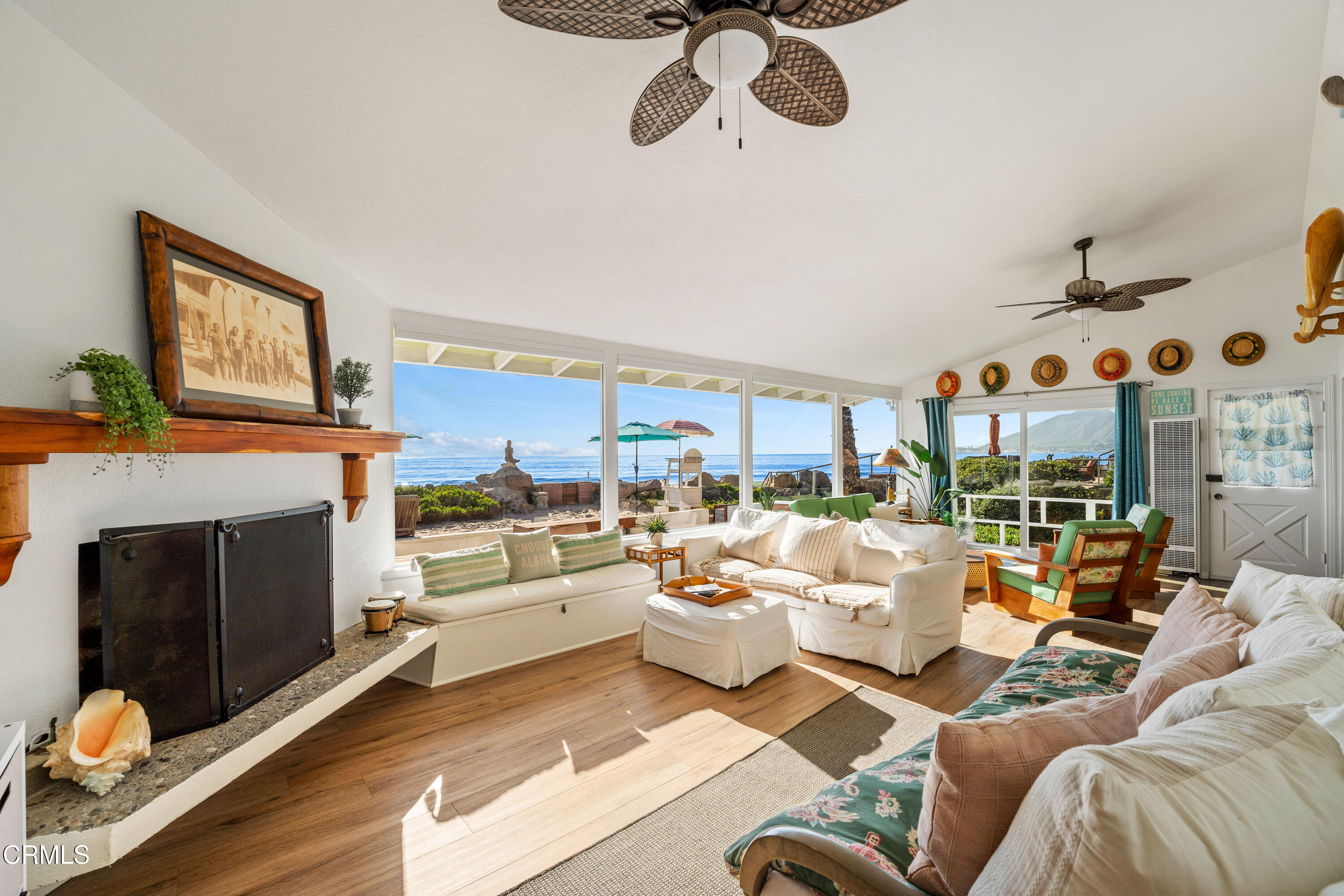 3048 Solimar Beach Drive Ventura, CA 93001 - Photo 18 of 35 a living room with furniture kitchen view and a fireplace