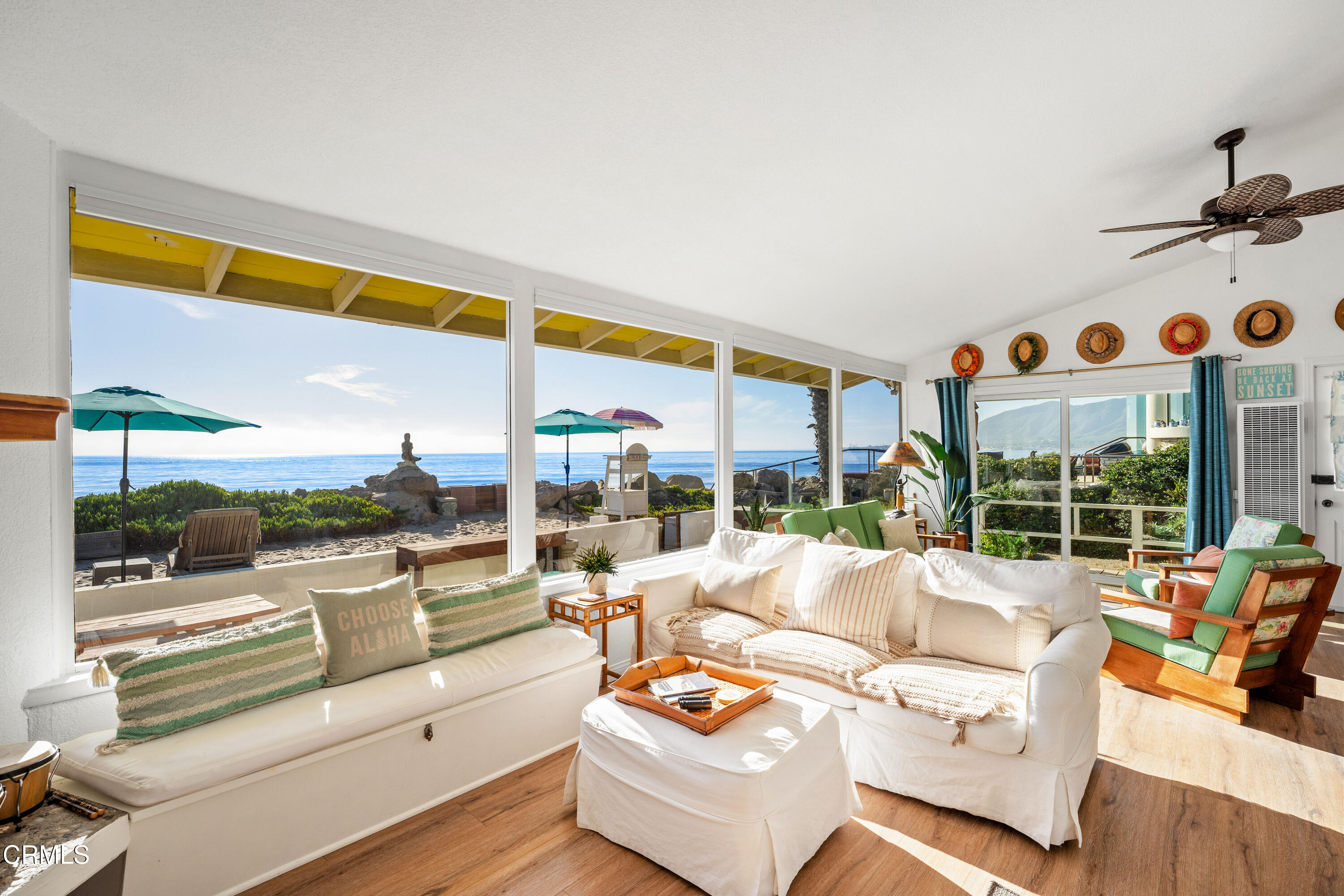 3048 Solimar Beach Drive Ventura, CA 93001 - Photo 19 of 35 a living room with patio furniture and a floor to ceiling window