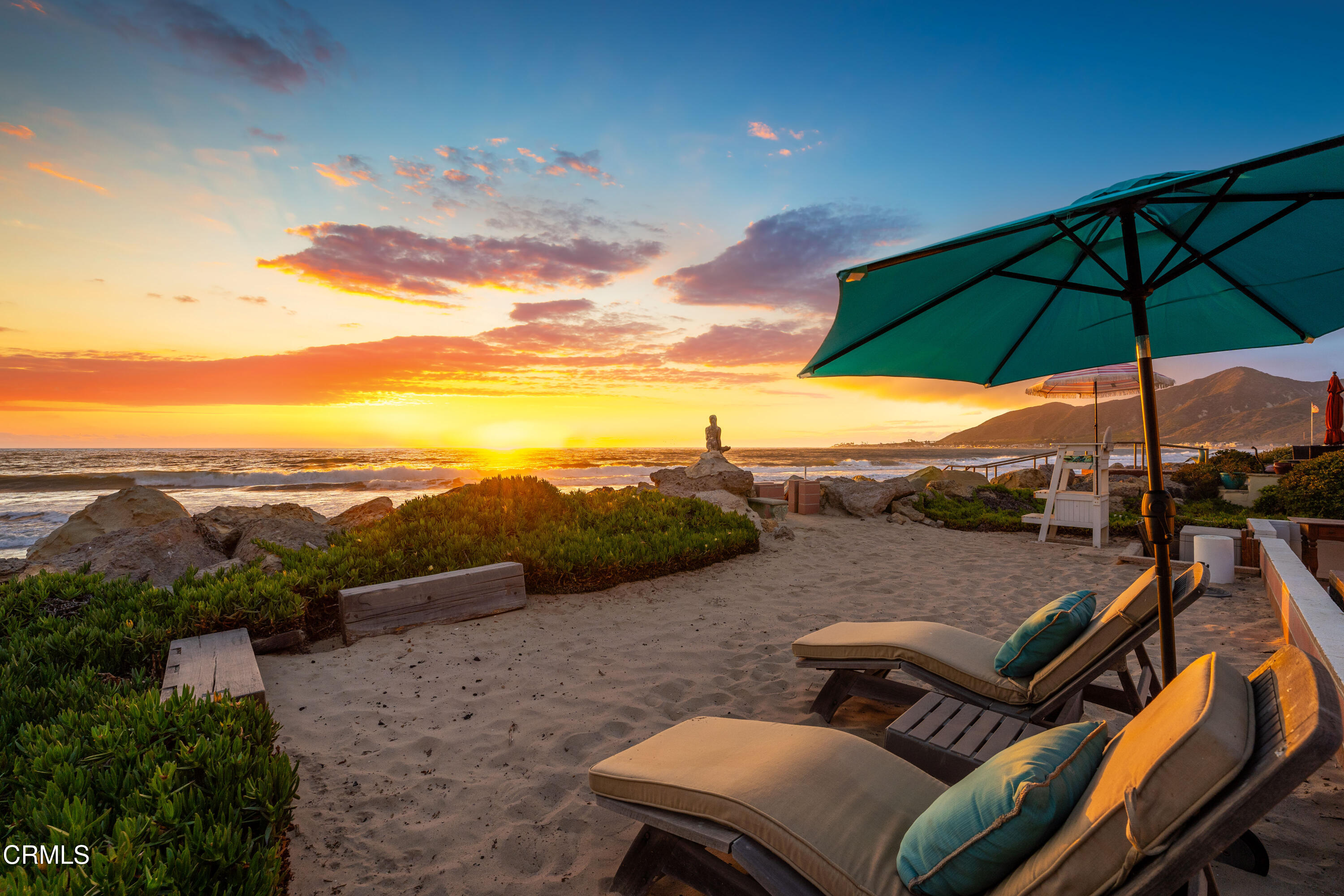 3048 Solimar Beach Drive Ventura, CA 93001 - Photo 30 of 35 a view of a patio with couches under an umbrella