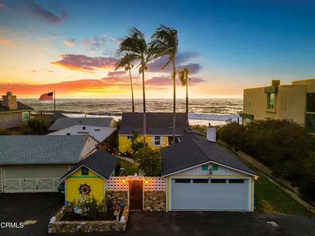 an aerial view of houses with yard