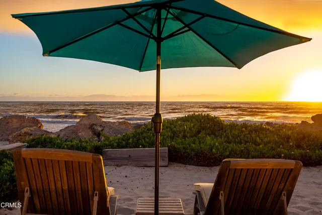 a view of a balcony with an outdoor seating