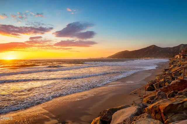 a view of an ocean and a mountain