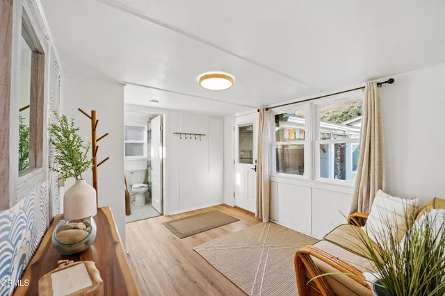 a bedroom with furniture and a window