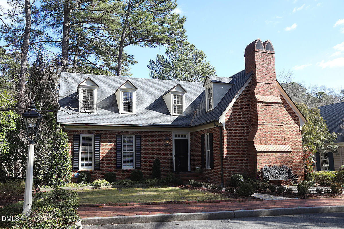 815 Marlowe Road, Unit 10 Raleigh, NC 27609 - Photo 1 of 28 a front view of a house with yard and parking space