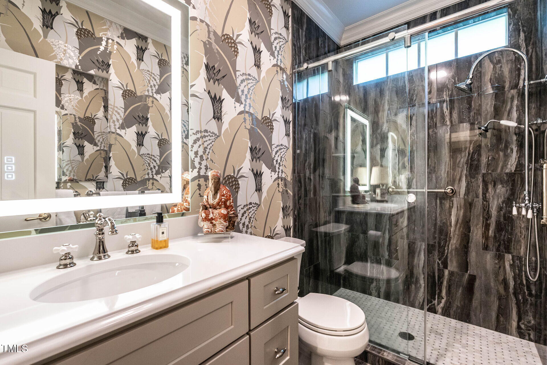 815 Marlowe Road, Unit 10 Raleigh, NC 27609 - Photo 14 of 28 a bathroom with a sink a toilet a mirror and shower