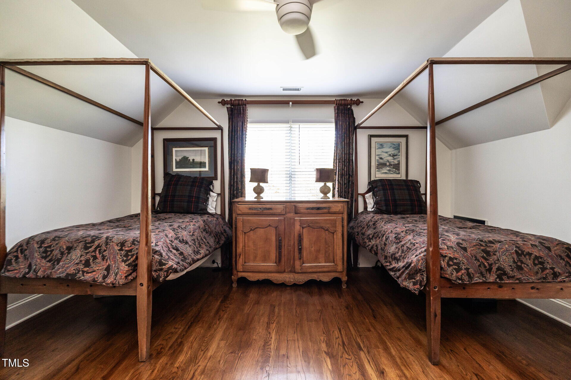 815 Marlowe Road, Unit 10 Raleigh, NC 27609 - Photo 17 of 28 a bedroom with a bed and wooden floor
