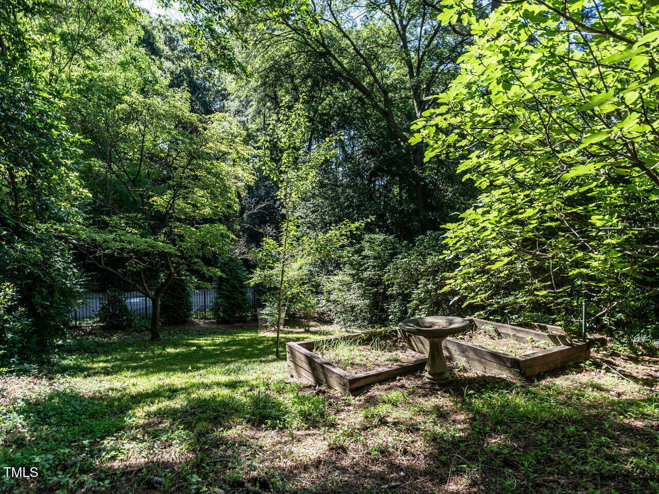 815 Marlowe Road, Unit 10 Raleigh, NC 27609 - Photo 23 of 28 a garden view with a bench