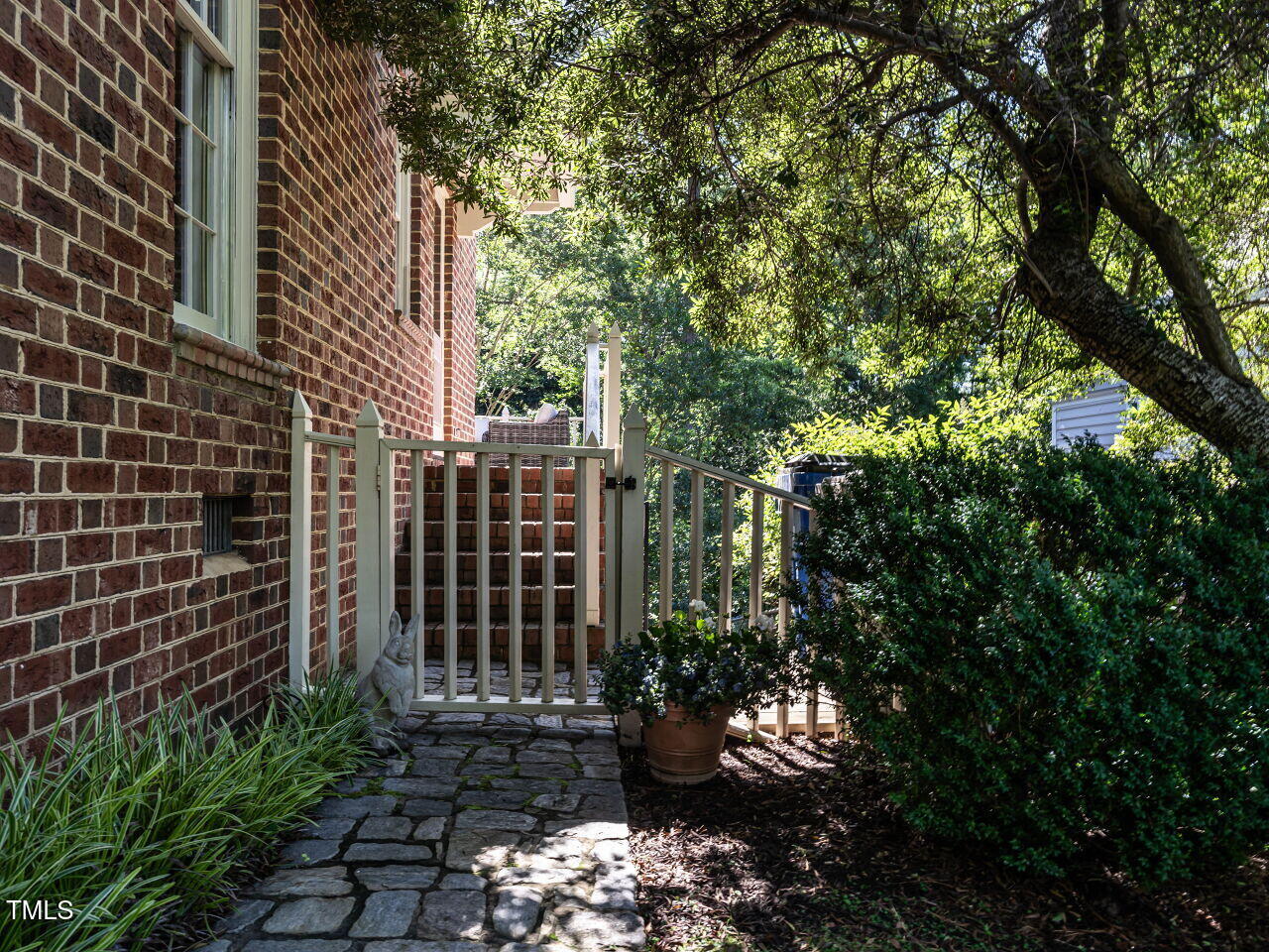 815 Marlowe Road, Unit 10 Raleigh, NC 27609 - Photo 25 of 28 a view of a backyard with plants and trees