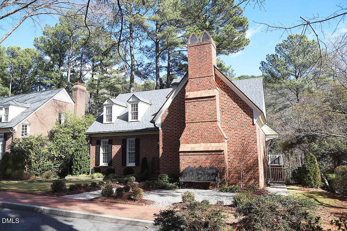 815 Marlowe Road, Unit 10 Raleigh, NC 27609 - Photo 3 of 28 a front view of a house with lots of trees