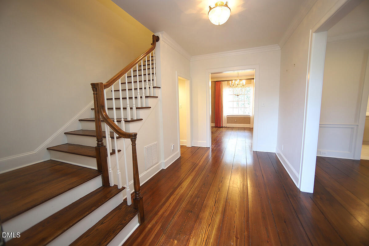 815 Marlowe Road, Unit 10 Raleigh, NC 27609 - Photo 5 of 28 a view of a hallway with wooden floor and staircase
