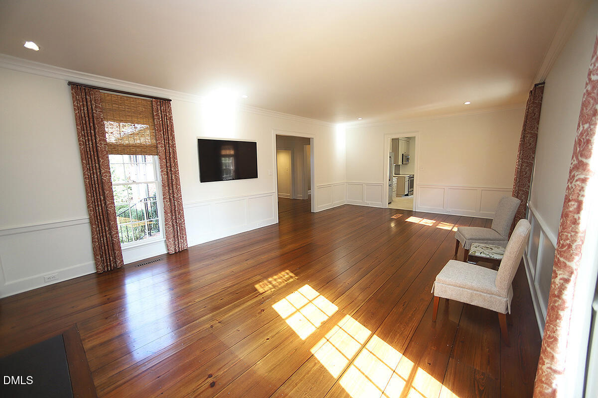 815 Marlowe Road, Unit 10 Raleigh, NC 27609 - Photo 7 of 28 a view of living room with furniture and a flat screen tv