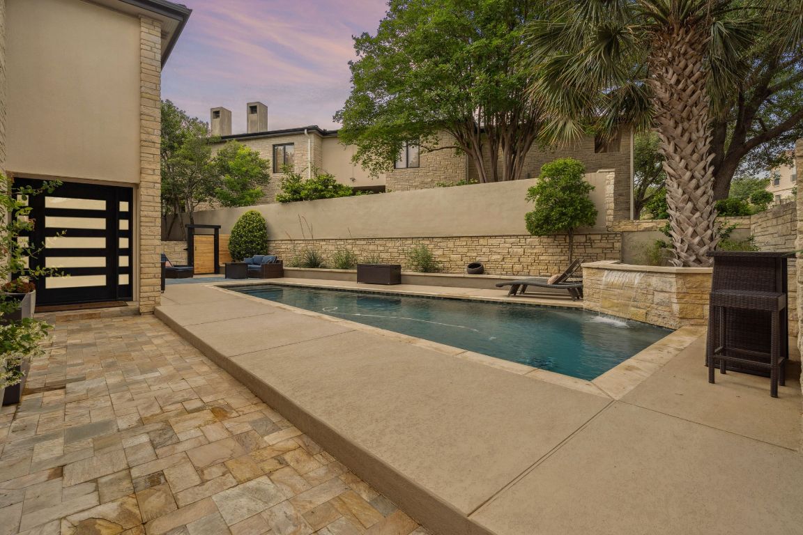 9 Swiftwater Trail The Hills, TX 78738 - Photo 1 of 34 View of swimming pool with a patio area