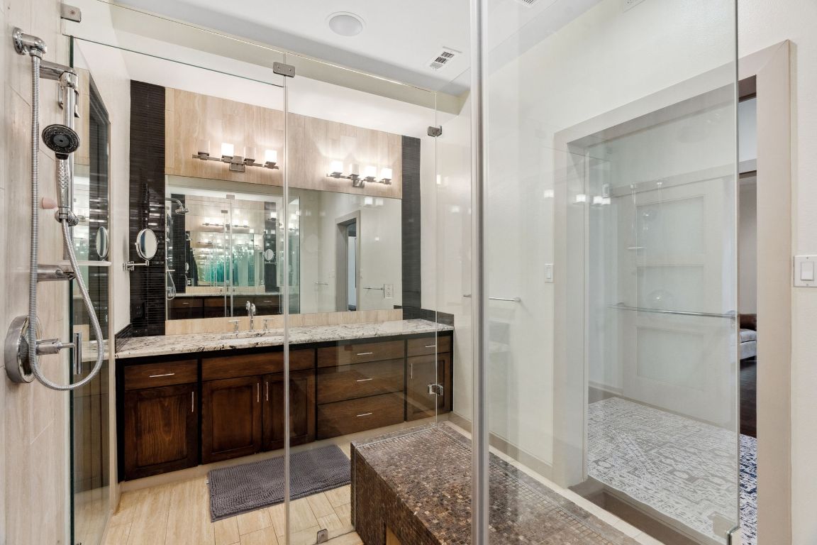 9 Swiftwater Trail The Hills, TX 78738 - Photo 23 of 34 Bathroom with vanity and a stall shower