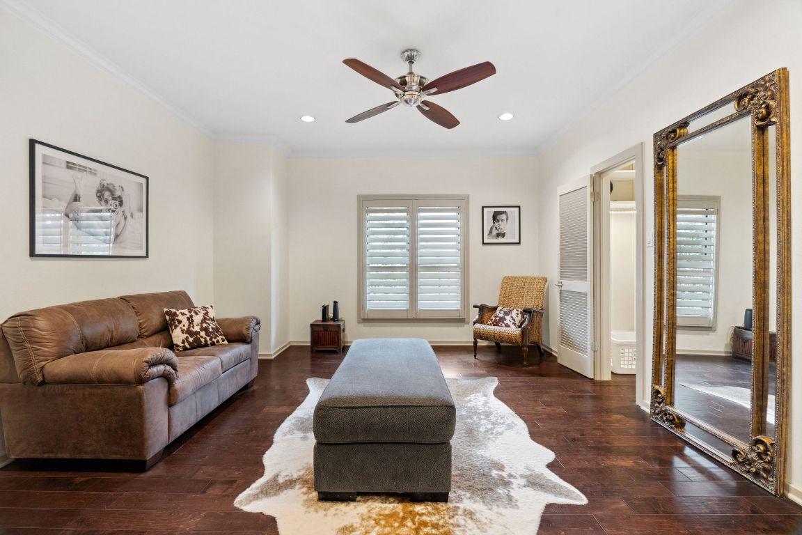 9 Swiftwater Trail The Hills, TX 78738 - Photo 24 of 34 Living room with ornamental molding, dark wood-style flooring, ceiling fan, and recessed lighting