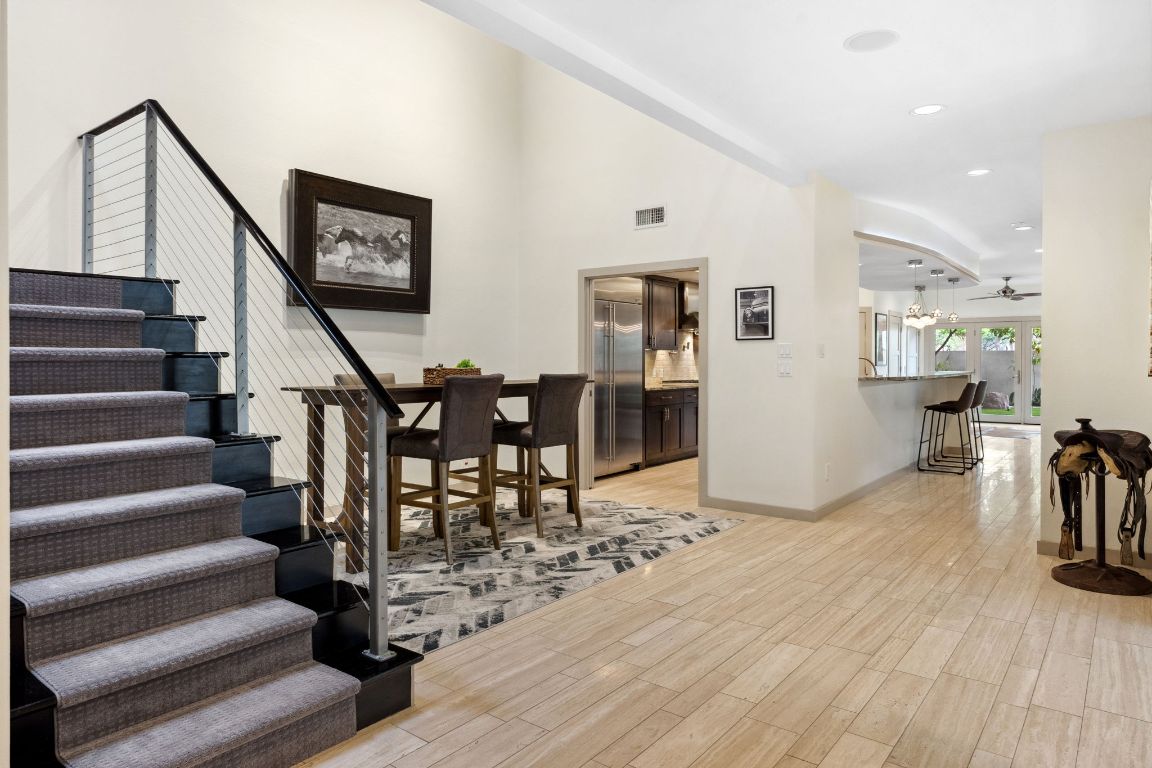 9 Swiftwater Trail The Hills, TX 78738 - Photo 3 of 34 Foyer with light wood-style flooring, ceiling fan, recessed lighting, and stairway