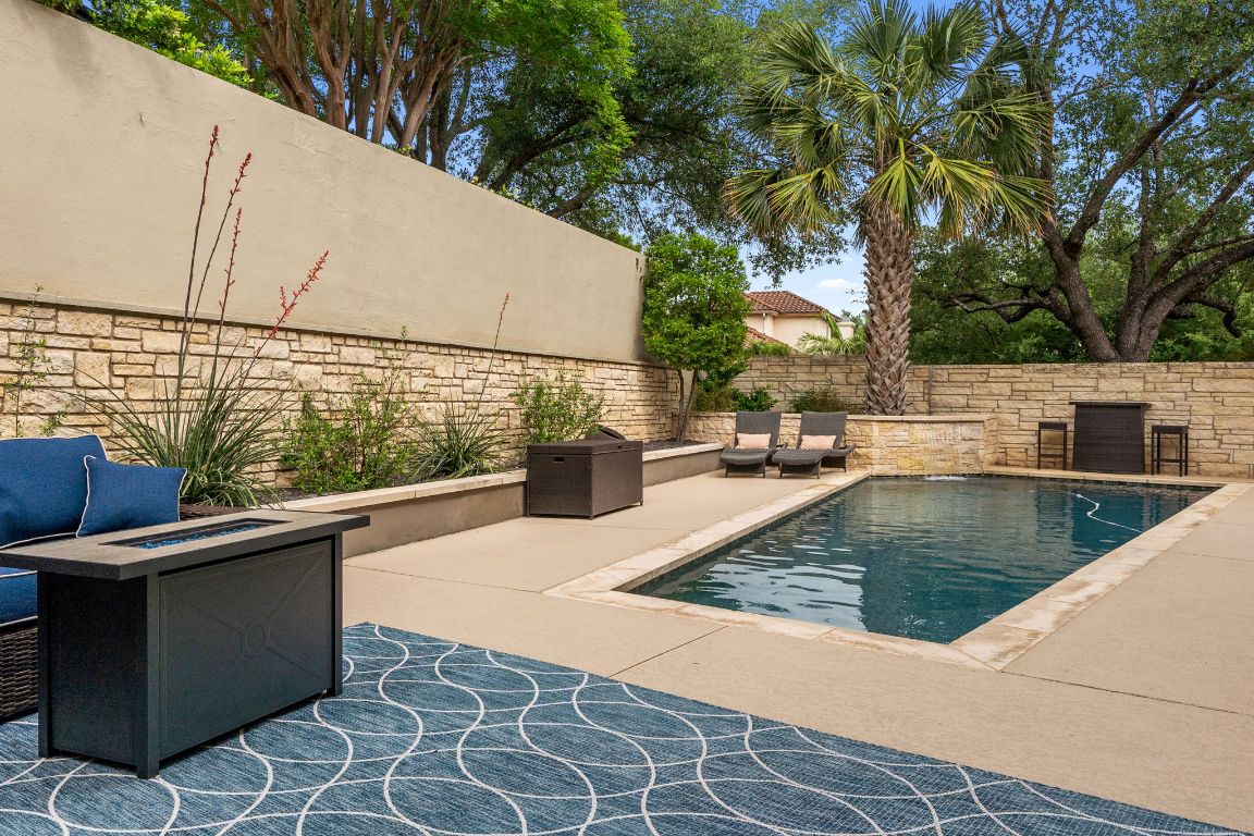 9 Swiftwater Trail The Hills, TX 78738 - Photo 33 of 34 View of pool with a patio, a fire pit, and a fenced backyard