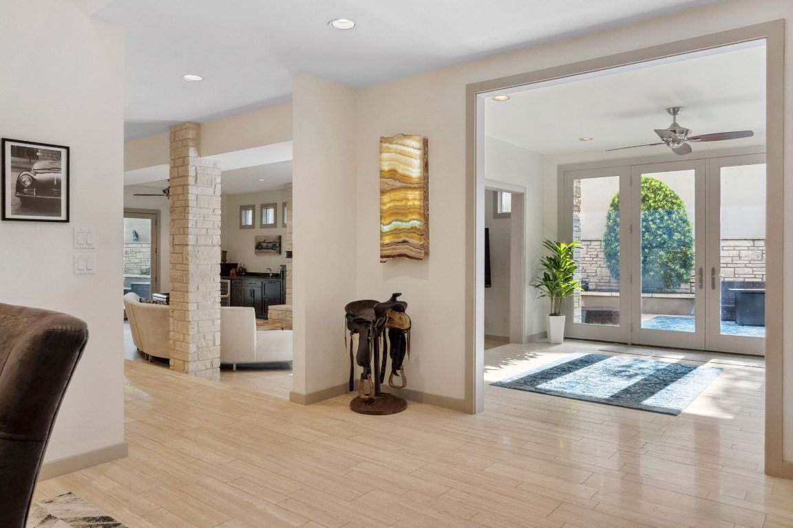 9 Swiftwater Trail The Hills, TX 78738 - Photo 5 of 34 Corridor with ornate columns, recessed lighting, and light wood-style floors
