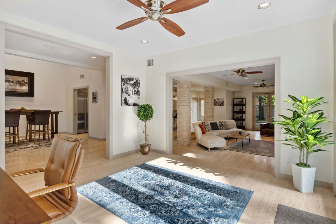 9 Swiftwater Trail The Hills, TX 78738 - Photo 7 of 34 Living room featuring recessed lighting, light wood finished floors, and ceiling fan