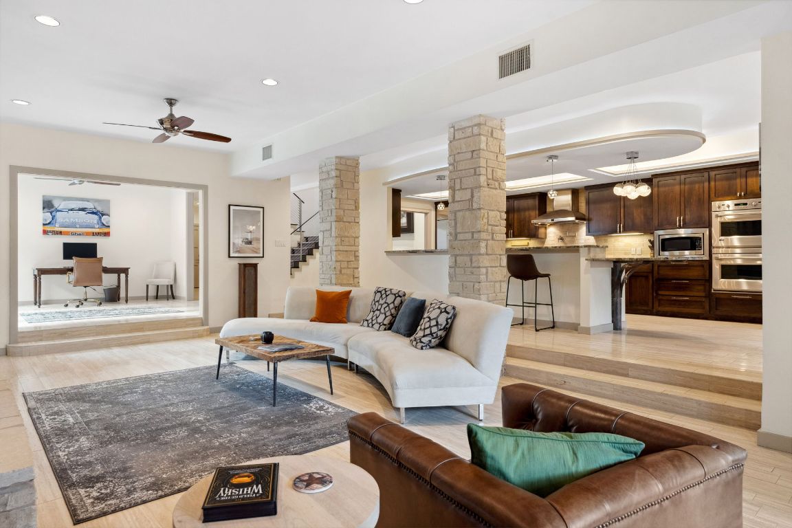 9 Swiftwater Trail The Hills, TX 78738 - Photo 9 of 34 Living area featuring an office area, decorative columns, light wood-style flooring, recessed lighting, and ceiling fan