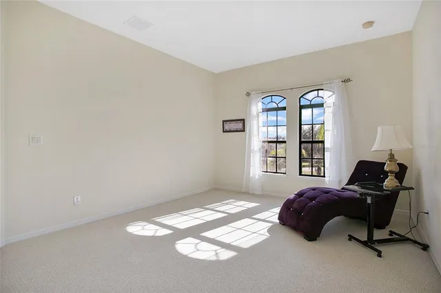a bedroom with bed and a window