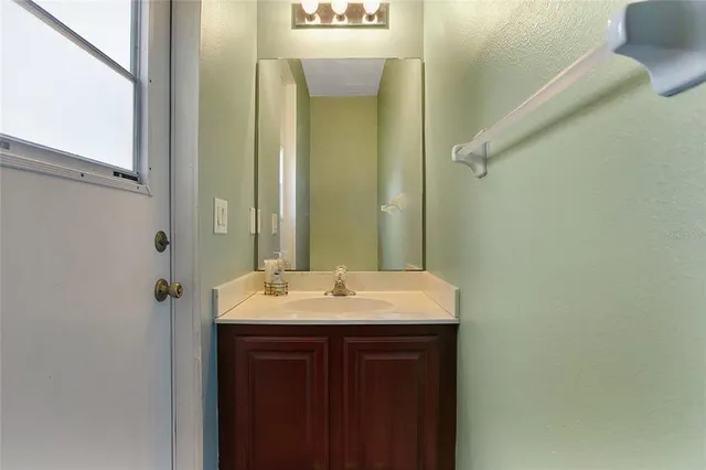 an aerial view of residential houses with outdoor space and river