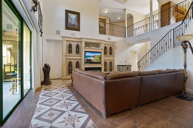 a living room with furniture and a fireplace
