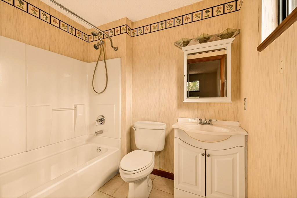 951 McClure Road Hayesville, NC 28904 - Photo 12 of 45 a bathroom with a shower a sink and a toilet