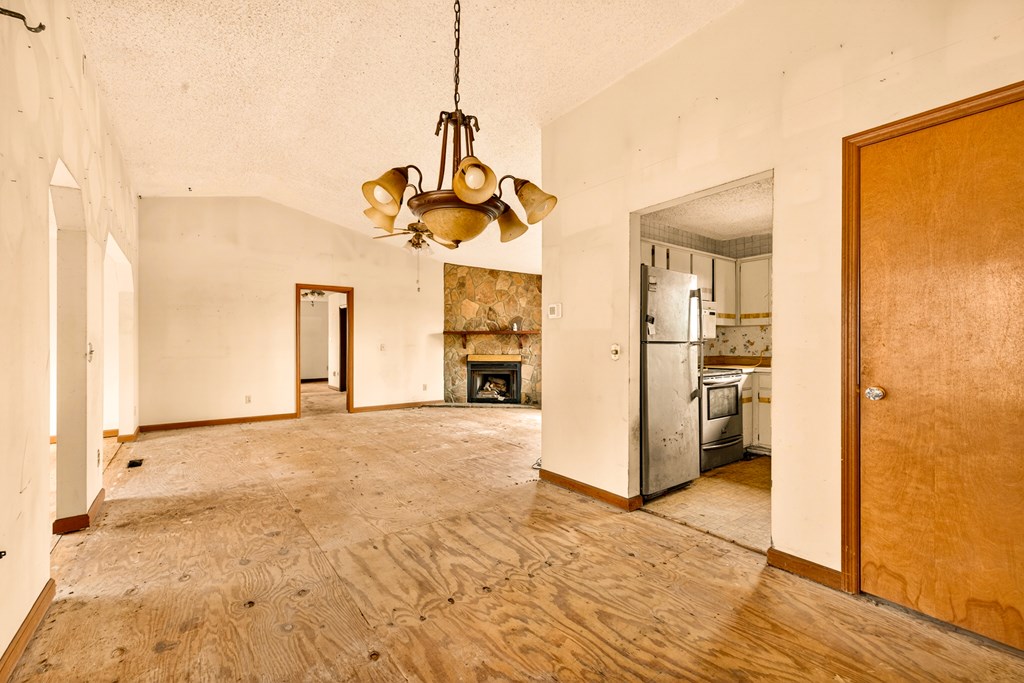 951 McClure Road Hayesville, NC 28904 - Photo 14 of 45 a view of empty room with wooden floor and a window