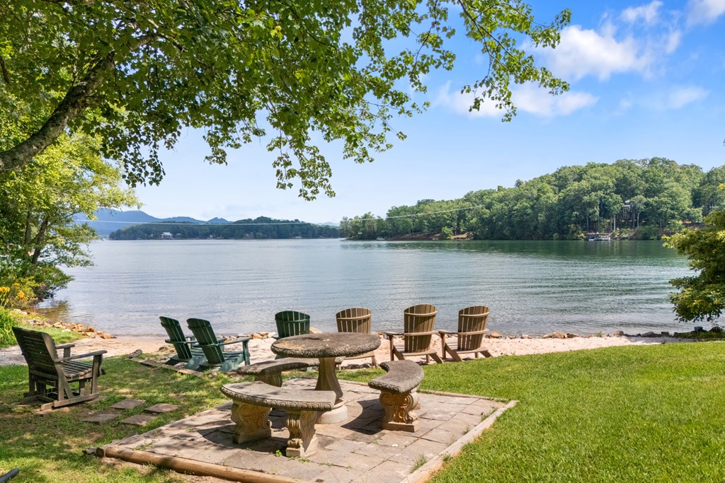 951 McClure Road Hayesville, NC 28904 - Photo 44 of 45 a view of a lake with lawn chairs and a table