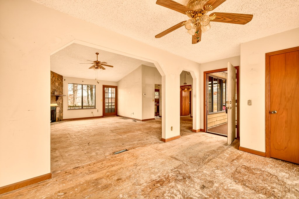951 McClure Road Hayesville, NC 28904 - Photo 5 of 45 a view of an empty room with chandelier fan and a window