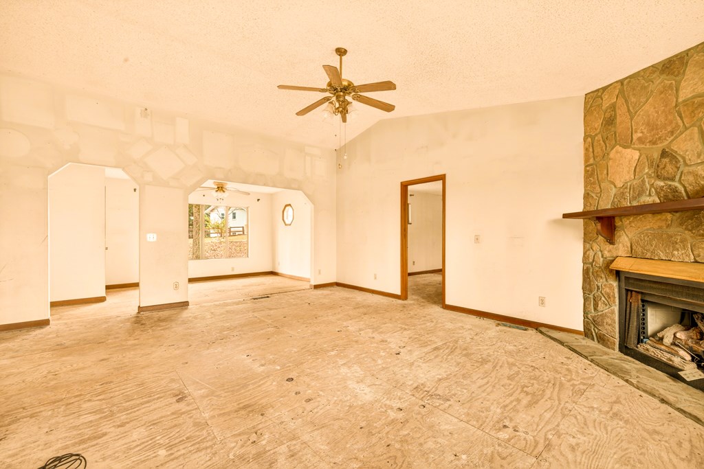 951 McClure Road Hayesville, NC 28904 - Photo 7 of 45 a view of a livingroom with a fireplace and a chandelier