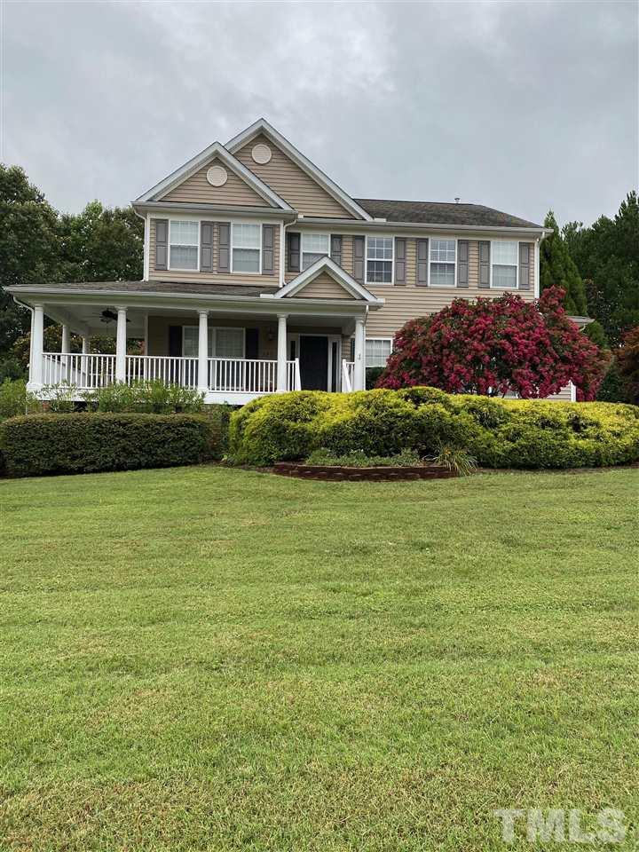 407 Challenge Road Raleigh, NC 27603 - Photo 1 of 29 a front view of a house with garden