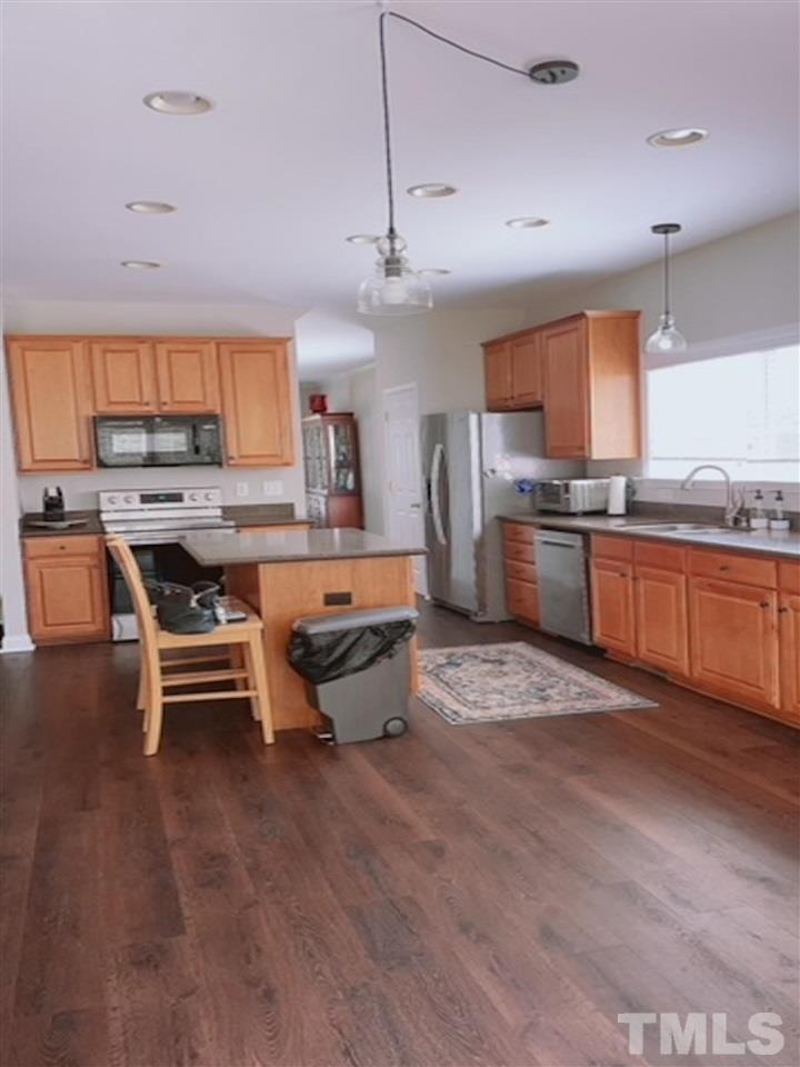 407 Challenge Road Raleigh, NC 27603 - Photo 15 of 29 a living room with stainless steel appliances granite countertop furniture stove and kitchen view