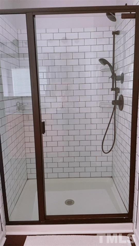 407 Challenge Road Raleigh, NC 27603 - Photo 25 of 29 a bathroom with a shower