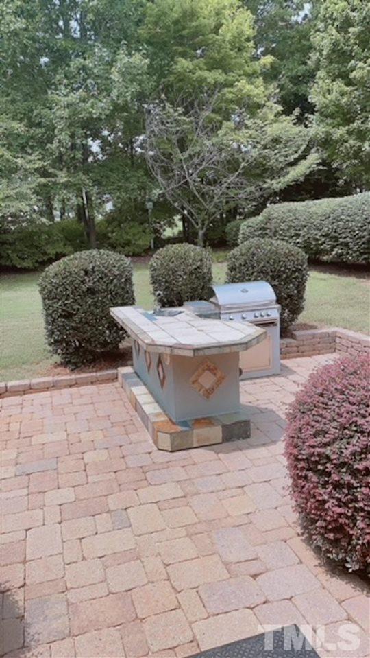 407 Challenge Road Raleigh, NC 27603 - Photo 28 of 29 a view of a backyard of the house