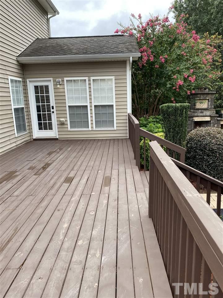 407 Challenge Road Raleigh, NC 27603 - Photo 6 of 29 a view of outdoor space with wooden floor and trees